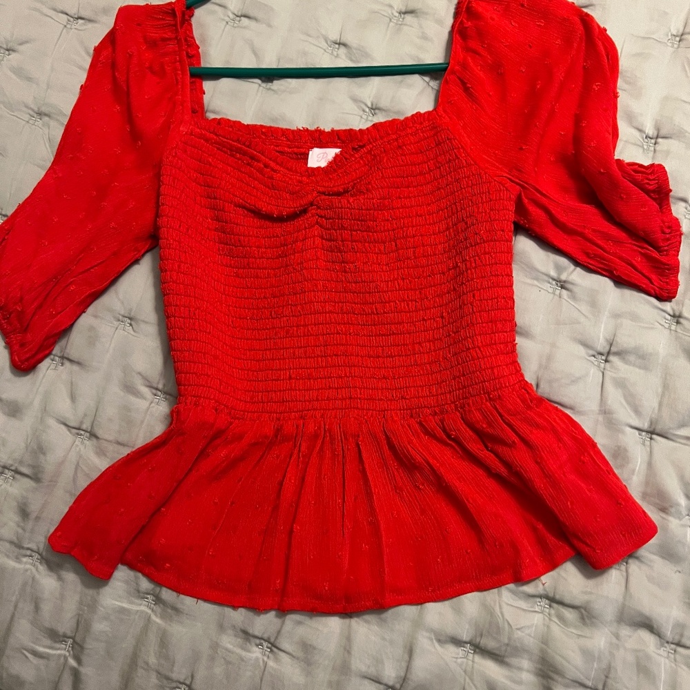 Red blouse from pink lily
